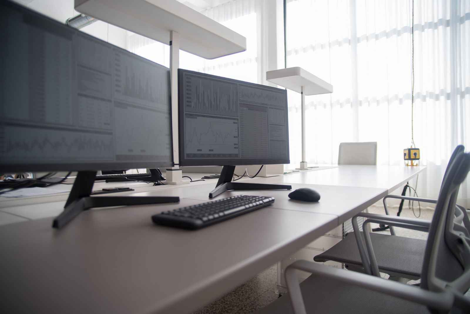 Multi-monitor dashboard setup displaying coordination and tracking data